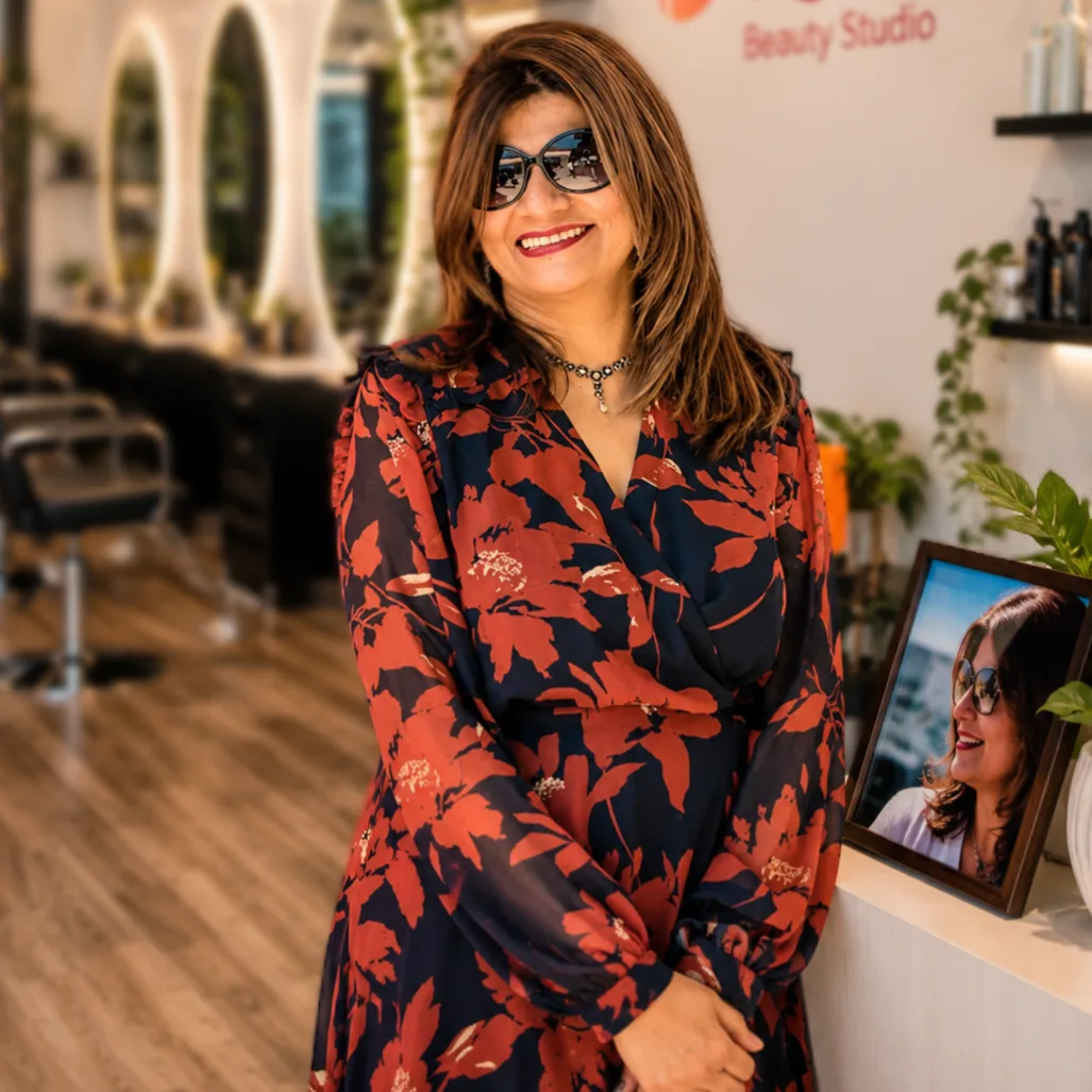 Master stylist performing luxury hair artistry at Kausar Beauty Salon